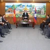 越南国家主席陈大光与老挝占巴塞省若干领导人举行工作会议。（图片来源：越通社）