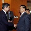 越南财政部部长丁进勇与亚洲开发银行行长中尾武彦。