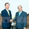 越南政府总理阮春福会见希杰（CJ）集团全球高级顾问郑英秀（图片来源：越通社）