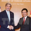 附图：2013年越南政府副总理兼外交部长范平明会见访越的美国国务卿约翰·克里（图片来源：越通社）