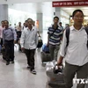 附图：在外就业的越南劳工回国