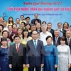 国家主席陈大光会见旅外模范越侨代表。（图片来源：越通社）