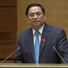 越南政府总理范明政解答选民和国会代表关注的问题