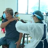 越南加快对18岁以上人员第三针接种进度