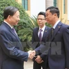 越南公安部部长苏林上将和缅甸内政部部长觉瑞（图片来源：越通社）