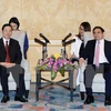 越共中央组织部部长范明（右）会见中共中央宣传部部长刘奇葆​ （图片来源：越通社）