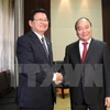 越南政府总理阮春福与老挝总理通论。