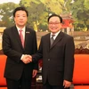 河内市委书记黄忠海（右）与北京市政协主席吉林（左）