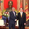 国家主席陈大光(右）会见斯里兰卡总理拉尼尔·维克勒马辛哈。（图片来源：《越南之声》）