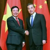 越南政府副总理兼外交部长范平明​与中国外交部长王毅。