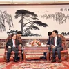 越南最高人民检察院检察长黎明志（左边）与中国最高人民检察院检察长曹建明