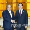 越南国家主席陈大光(右)会见巴基斯坦总理纳瓦兹·谢里夫