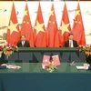 陈大光主席和习近平主席出席越中关于电子商务合作的谅解备忘录签字仪式。