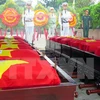 在老挝牺牲的越南志愿军和专家悼念安葬仪式。（图片来源：越通社）