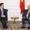 越南政府总理阮春福会见美国纳斯达克证券交易所高级副总裁麦柯奕。