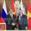 越南国家主席陈大光（左）与俄总统普京（右）。（图片来源：越通社）