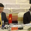 越南最高人民检察院院长黎明智（左）与老挝最高人民检察院院长坎山·苏冯共同主持会议。