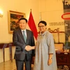 廷惠（左）与印尼外交部长蕾特诺‧马尔苏迪。
