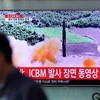 韩国电视台报道有关朝鲜试射洲际弹道导弹的消息。