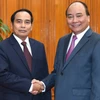 阮春福总理与老挝副总理本通·吉玛尼。（图片来源：因特网）