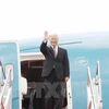 阮富仲抵达雅加达苏加诺-哈达国际机场。（图片来源：越通社）