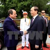 越南国家主席陈大光（右）和埃及总统塞西。（图片来源：越通社）