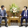 越南政府副总理郑廷勇会见日本三菱公司副总裁吉田良雄。（图片来源：越通社）