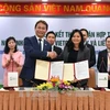 越南外贸股份商业银行（VCB）与新加坡制造商总会（SMF）签署全面合作协议。（图片来源：越通社）