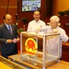 ​越南党与国家领导投票通过交通运输部部长和政府总监察长等职务的任命事宜。（图片来源：越通社）