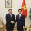 越南政府副总理武德儋会见中国文化部部长雒树刚。（图片来源：越通社）