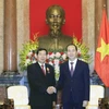 越南国家主席陈大光会见老挝最高人民法院院长坎潘·西提丹帕。（图片来源：越通社）