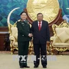 老挝人民革命党中央总书记、国家主席本扬会见越南高级军事代表团