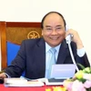 阮春福总理通电话祝贺越南U23足球队。（图片来源：越通社）