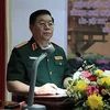 越南人民军总政治局副主任阮仲义上将拜会老挝人民军总政治局主任维莱•拉坎冯中将