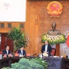 越南政府总理阮春福与最高人民检察院举行工作会议。（图片来源：越通社）