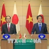 陈大光与日本首相安倍晋三共同举行联合新闻发布会