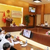 越共中央检查团与国会党团举行工作会谈