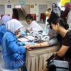 旅居马来西亚越南人接受免费的心血管疾病咨询