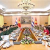 越南人民军高级军事代表团同古巴高级军事代表团举行会谈