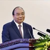阮春福总理主持召开越南与老挝和柬埔寨合作项目评估会议