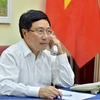 越南政府副总理兼外长范平明与安哥拉共和国外长通电话