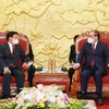 老挝人民革命党总书记、国家主席通伦会见前越共中央总书记农德孟和前国家主席陈德良