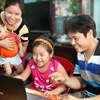 “家庭——温馨港湾”图片展推崇越南家庭的价值