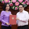 越南政府总理范明政颁发越通社社长任命决定