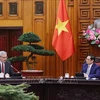 越南政府总理范明政会见法国驻越南大使沃纳里