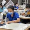 越南全国834万名受疫情影响劳动者获得失业保险基金的资金支持
