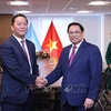 越南政府总理范明政会见并与各投资基金、集团领导通电话