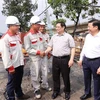 越南政府总理范明政与全国工人和劳动者举行对话