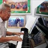 越老关系60周年：把胡主席的诗词谱成歌曲的老挝音乐家