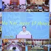  越南政府总理范明政主持新冠肺炎疫情防控视频会议